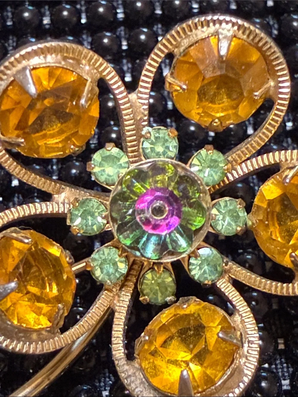 Vintage 70s Gold-Tone Orange Crystal Flower Brooch with Green Leaf Accents